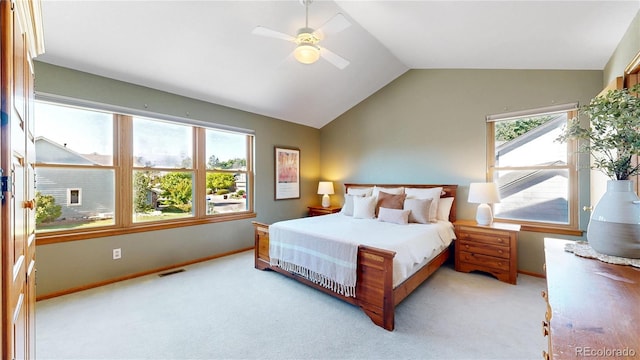 14633 W 69th Pl, Arvada, CO 80004 - carpeted bedroom featuring multiple windows, lofted ceiling, and ceiling fan