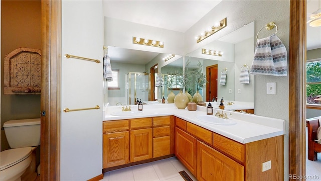 14633 W 69th Pl, Arvada, CO 80004 - full bathroom with double vanity, a stall shower, and tile patterned floors