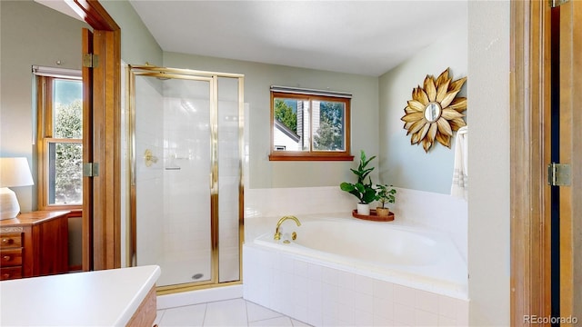 14633 W 69th Pl, Arvada, CO 80004 - full bathroom with a bath, a stall shower, tile patterned floors, and vanity