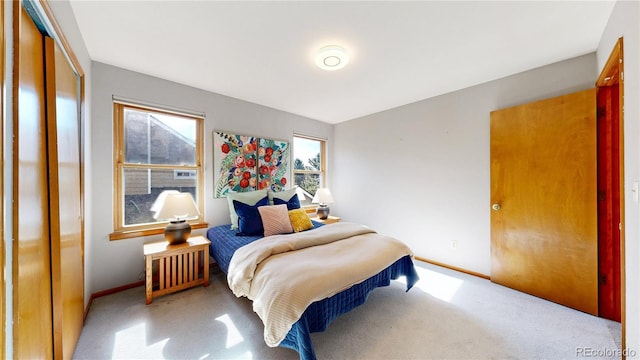 14633 W 69th Pl, Arvada, CO 80004 - carpeted bedroom featuring baseboards and a closet