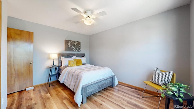 14633 W 69th Pl, Arvada, CO 80004 - bedroom featuring light wood-style floors and a ceiling fan