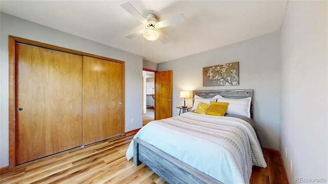14633 W 69th Pl, Arvada, CO 80004 - bedroom with light wood-style floors, a closet, and a ceiling fan