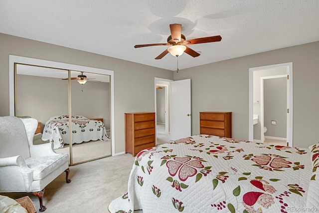 7466 E Long Cir, Centennial, CO 80112 - bedroom featuring a closet, light colored carpet, ceiling fan, ensuite bath, and baseboards