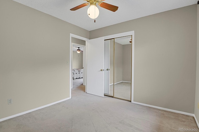 7466 E Long Cir, Centennial, CO 80112 - unfurnished bedroom featuring carpet, a closet, baseboards, and ceiling fan