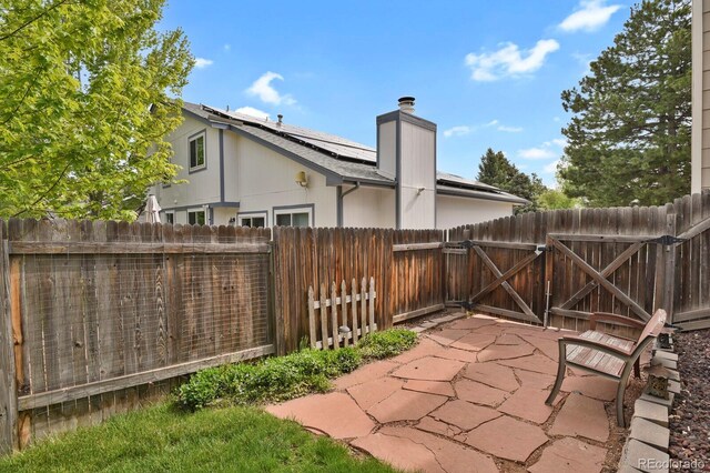 7466 E Long Cir, Centennial, CO 80112 - view of patio featuring a fenced backyard and a gate