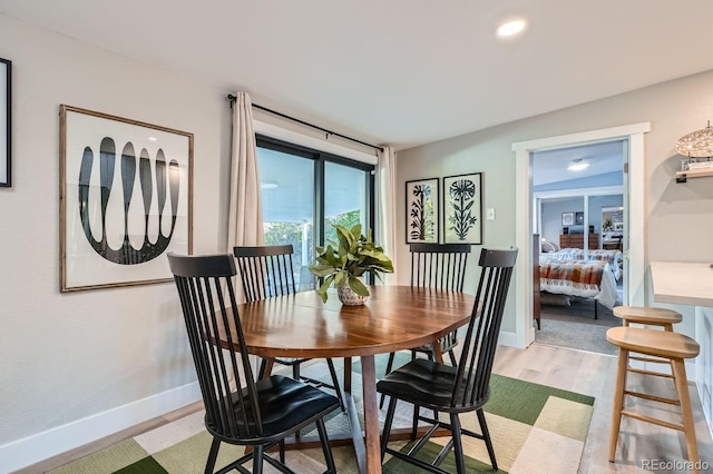 dining space featuring light hardwood / wood-style flooring