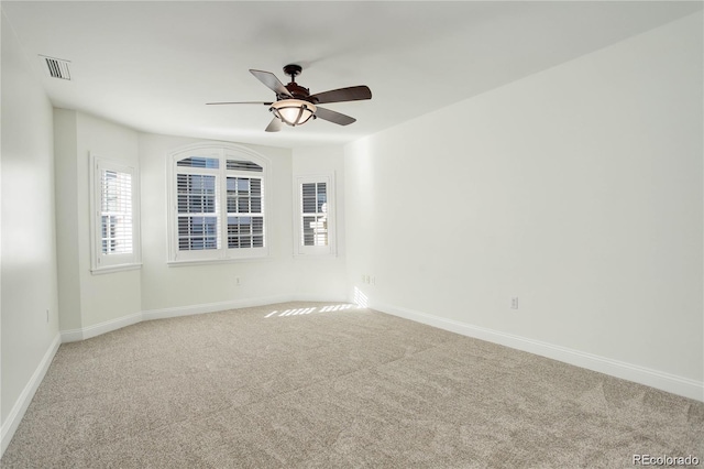 1950 N Logan St Unit 102, Denver, CO 80203 - spare room with carpet flooring, plenty of natural light, and ceiling fan