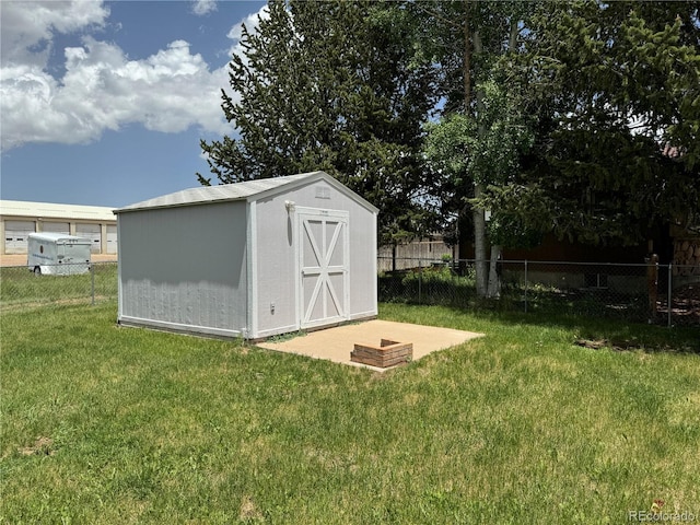 view of outbuilding with a lawn