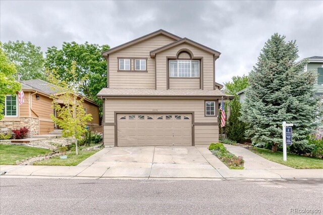 10191 Sagecrest St, Highlands Ranch, CO 80126 - traditional-style home featuring a garage and driveway