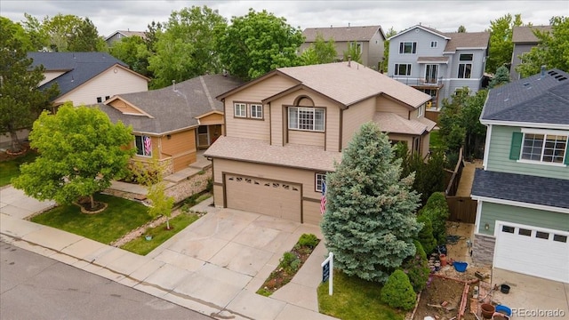 10191 Sagecrest St, Highlands Ranch, CO 80126 - traditional-style house with driveway, a garage, a residential view, and a shingled roof