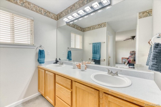 10191 Sagecrest St, Highlands Ranch, CO 80126 - full bathroom featuring double vanity, a ceiling fan, and baseboards