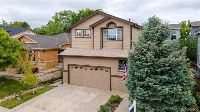 10191 Sagecrest St, Highlands Ranch, CO 80126 - view of front facade featuring an attached garage, driveway, and roof with shingles