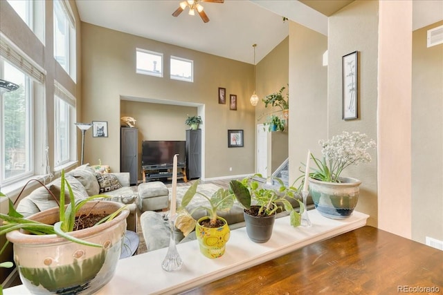 10191 Sagecrest St, Highlands Ranch, CO 80126 - living room with a high ceiling, a ceiling fan, wood finished floors, and baseboards