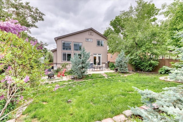 10191 Sagecrest St, Highlands Ranch, CO 80126 - rear view of house featuring a fire pit and a patio area