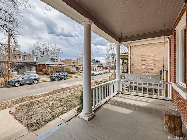 view of patio with a porch and a residential view