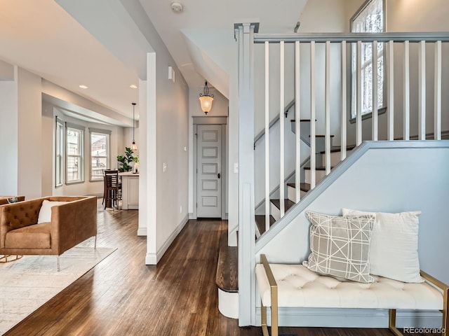 entrance foyer featuring stairs, recessed lighting, wood finished floors, and baseboards