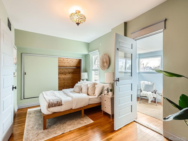 bedroom with hardwood / wood-style flooring