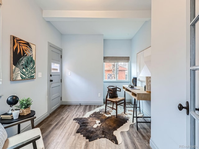 home office featuring baseboards and wood finished floors