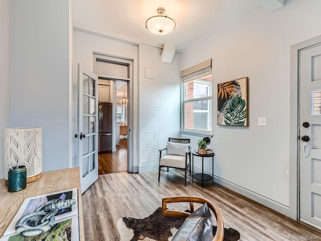 interior space featuring wood finished floors and baseboards