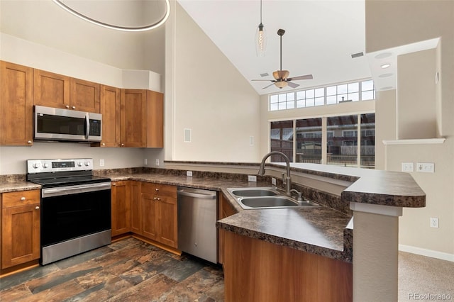 kitchen with sink, high vaulted ceiling, appliances with stainless steel finishes, kitchen peninsula, and ceiling fan