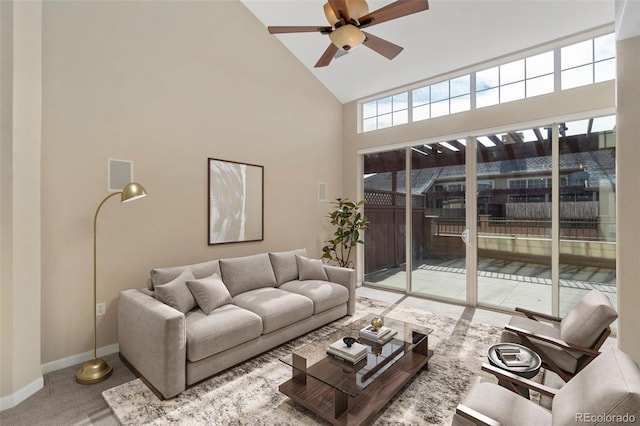 living room with ceiling fan and high vaulted ceiling