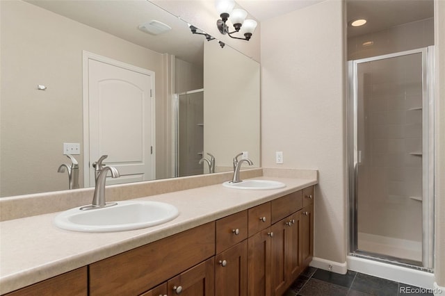 bathroom with vanity, tile patterned flooring, and walk in shower