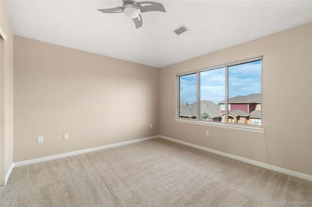 unfurnished room featuring ceiling fan and light colored carpet