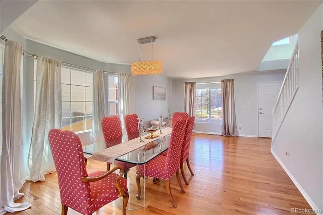 16893 Trail View Cir, Parker, CO 80134 - dining space with light wood-style flooring, baseboards, and stairs