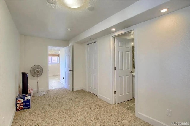 16893 Trail View Cir, Parker, CO 80134 - empty room featuring light carpet, baseboards, recessed lighting, and light tile patterned floors
