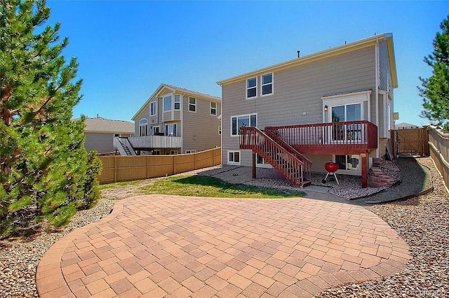 16893 Trail View Cir, Parker, CO 80134 - rear view of house featuring a patio, a fenced backyard, stairs, and a deck