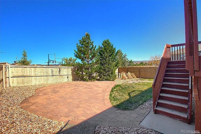 16893 Trail View Cir, Parker, CO 80134 - fenced backyard featuring stairway and a patio area