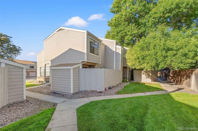 exterior space featuring a shed and a front lawn