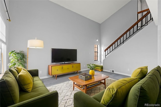 living room featuring high vaulted ceiling