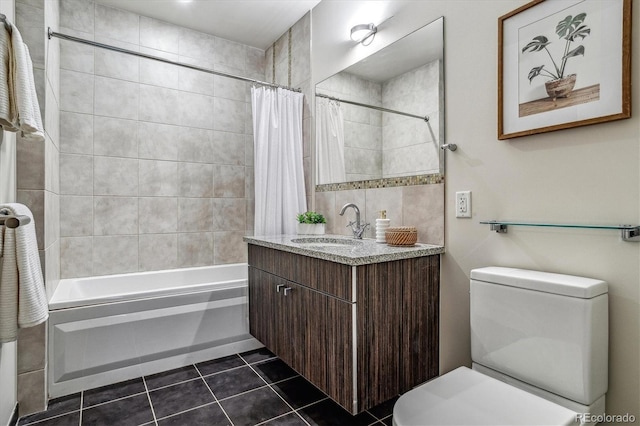 bathroom with tile patterned flooring, vanity, toilet, and shower / bath combo with shower curtain