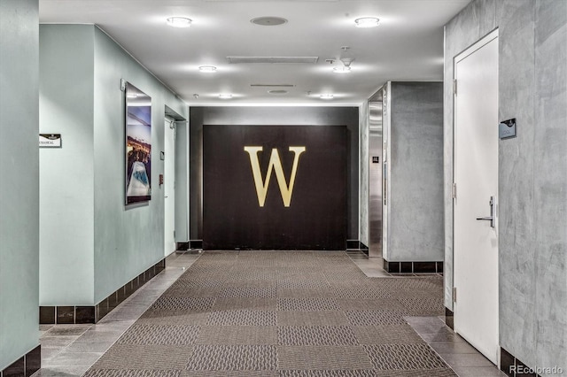 corridor featuring tile patterned floors