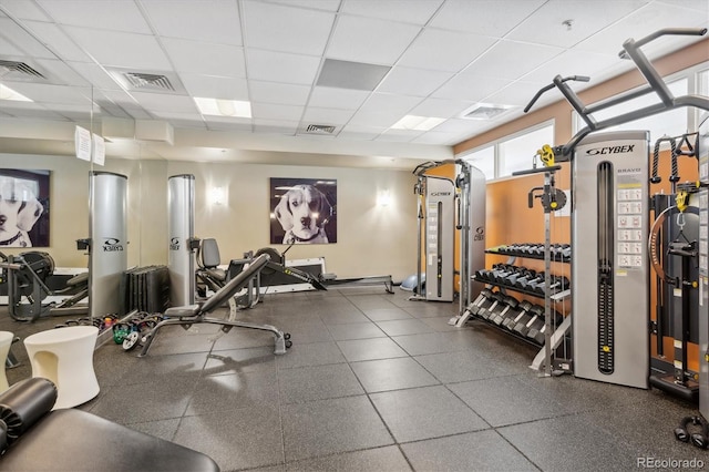 exercise room featuring a drop ceiling and visible vents