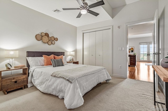 410 Acoma St Unit 518, Denver, CO 80204 - bedroom featuring carpet flooring, french doors, a closet, baseboards, and a ceiling fan