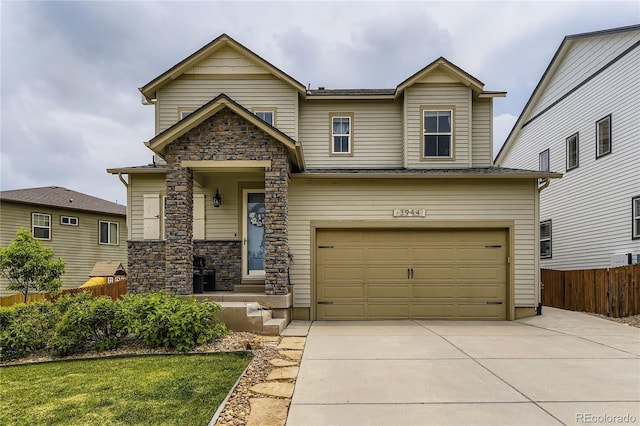 3944 Trail Stone Cir, Castle Rock, CO 80108 - view of front of home featuring a garage, driveway, and stone siding