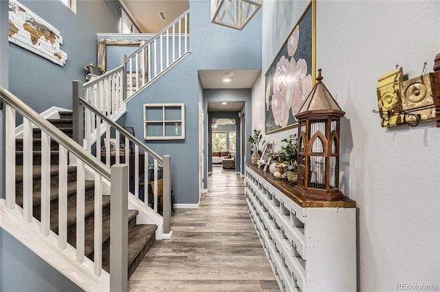 3944 Trail Stone Cir, Castle Rock, CO 80108 - stairs featuring wood finished floors and a high ceiling