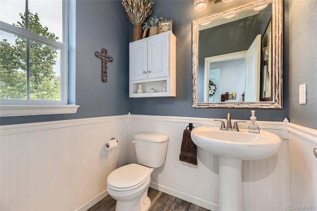 3944 Trail Stone Cir, Castle Rock, CO 80108 - half bathroom with wainscoting and wood finished floors