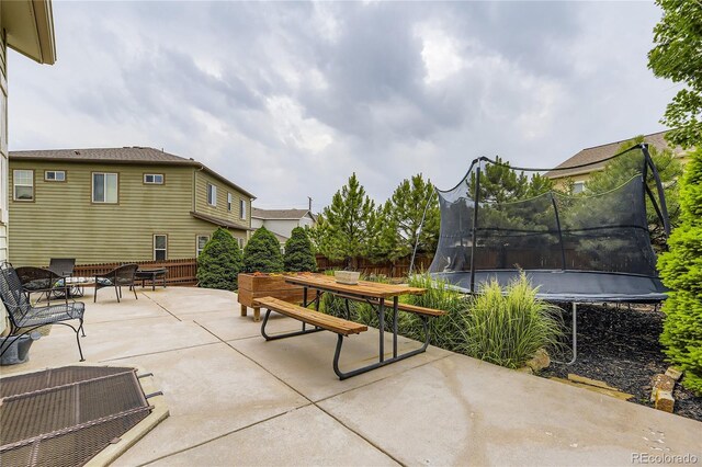3944 Trail Stone Cir, Castle Rock, CO 80108 - view of patio featuring a trampoline and outdoor dining space