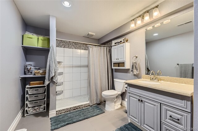 3944 Trail Stone Cir, Castle Rock, CO 80108 - full bathroom featuring vanity, a tile shower, and tile patterned floors
