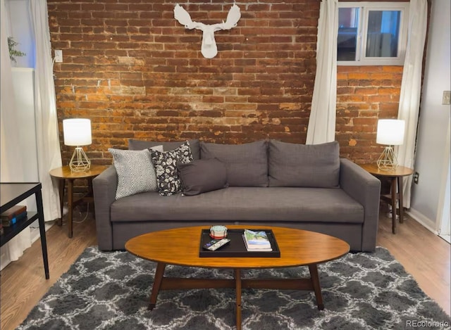 1351 N Franklin St, Denver, CO 80218 - living area with brick wall and wood finished floors