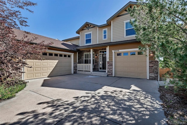 10646 Amesbury Way, Highlands Ranch, CO 80126 - craftsman inspired home featuring driveway, stone siding, and covered porch