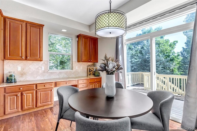 10646 Amesbury Way, Highlands Ranch, CO 80126 - dining area featuring light wood finished floors, healthy amount of natural light, and recessed lighting