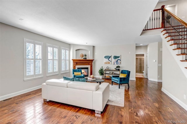 10646 Amesbury Way, Highlands Ranch, CO 80126 - living room with stairs, wood-type flooring, and a glass covered fireplace