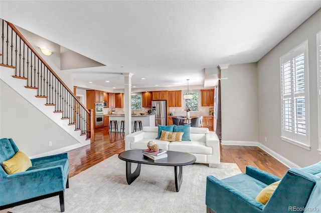 10646 Amesbury Way, Highlands Ranch, CO 80126 - living room with light wood-style flooring, stairs, and recessed lighting