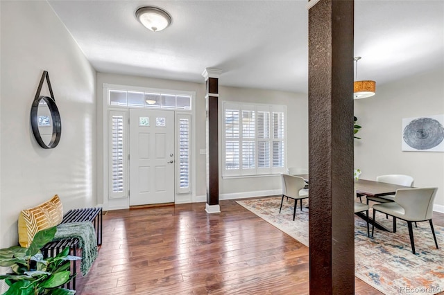 10646 Amesbury Way, Highlands Ranch, CO 80126 - foyer entrance featuring wood-type flooring and ornate columns