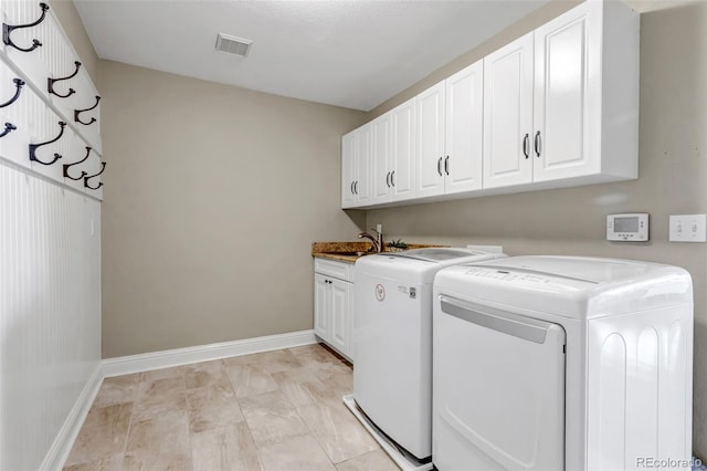 10646 Amesbury Way, Highlands Ranch, CO 80126 - washroom featuring separate washer and dryer and cabinet space