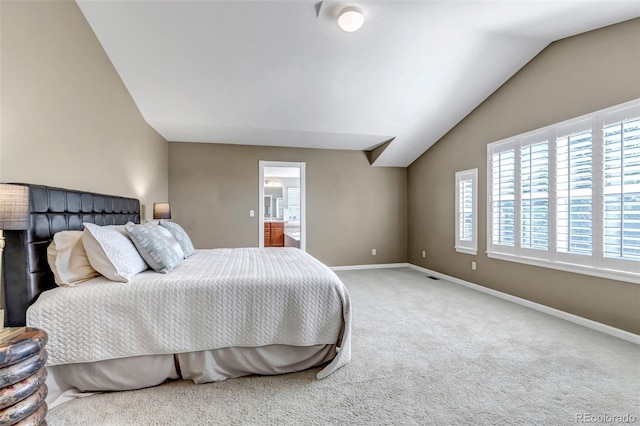 10646 Amesbury Way, Highlands Ranch, CO 80126 - bedroom featuring lofted ceiling, carpet floors, and connected bathroom